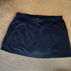 Black athletic skirt by Xersion with undershorts and hidden pockets, size M NWOT